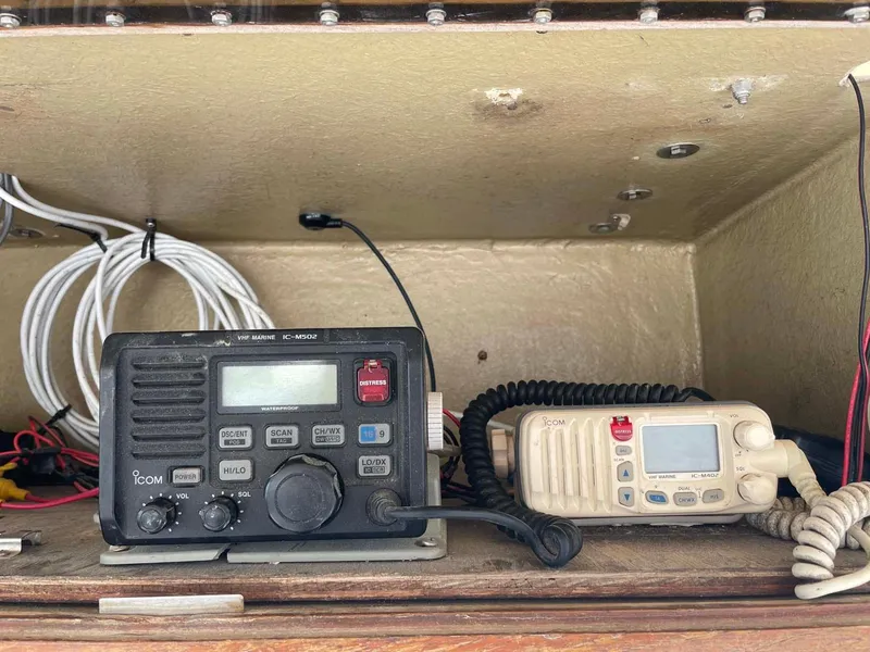 Slide: The Image of 1989 Rybo Runner Center Console radio equipment with wiring in storage compartment. - 14