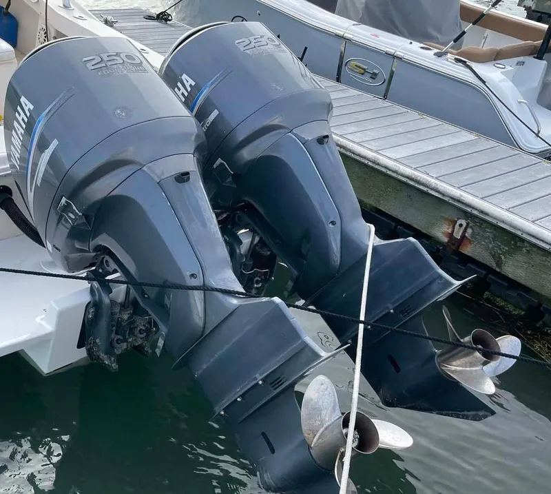 Slide: The Image of Twin Yamaha 250 outboard motors on a 1989 Rybo Runner Center Console boat. - 21