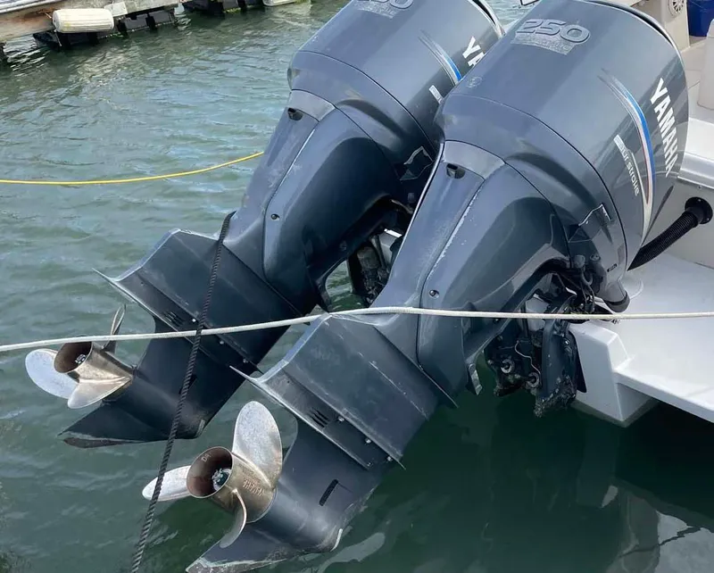 Slide: The Image of Twin Yamaha outboard motors on a 1989 Rybo Runner Center Console boat. - 22