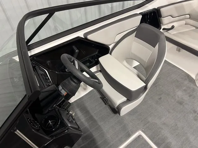 Slide: The Image of 2025 Yamaha AR190 boat interior with steering wheel and seating. - 12