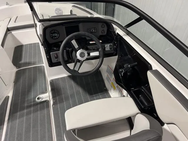 Slide: The Image of 2025 Yamaha Boats AR190 interior with steering wheel and dashboard controls. - 13