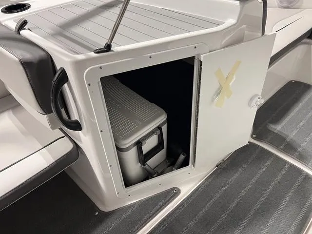 Slide: The Image of 2025 Yamaha AR190 boat storage compartment with cooler inside. - 14