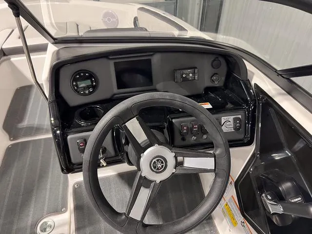 Slide: The Image of 2025 Yamaha Boats AR190 dashboard with steering wheel and control panel. - 15