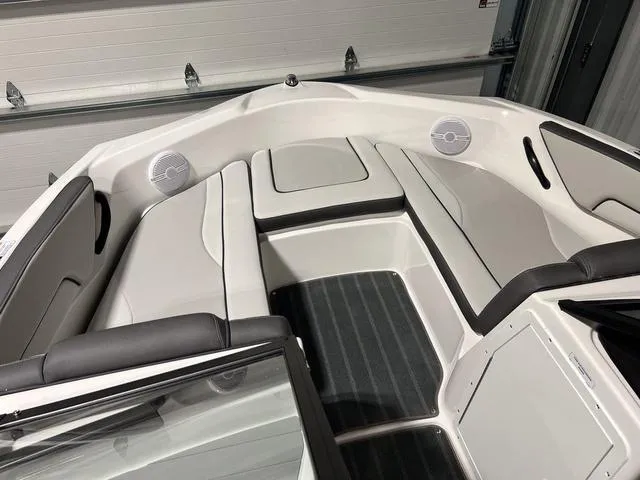 Slide: The Image of 2025 Yamaha AR190 boat interior with cushioned seating and speakers. - 20