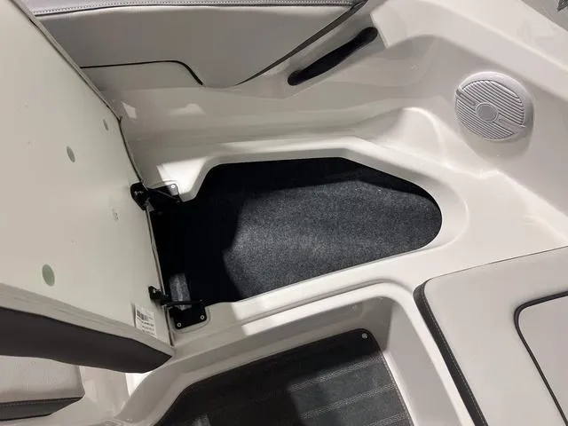 Slide: The Image of 2025 Yamaha AR190 boat interior storage compartment with speaker. - 21