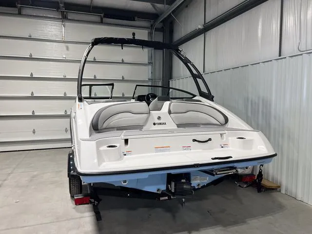 Slide: The Image of 2025 Yamaha AR190 boat in a garage, rear view. - 3
