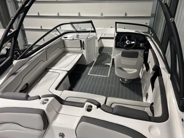 Slide: The Image of 2025 Yamaha Boats AR190 interior with sleek seating and modern dashboard. - 5