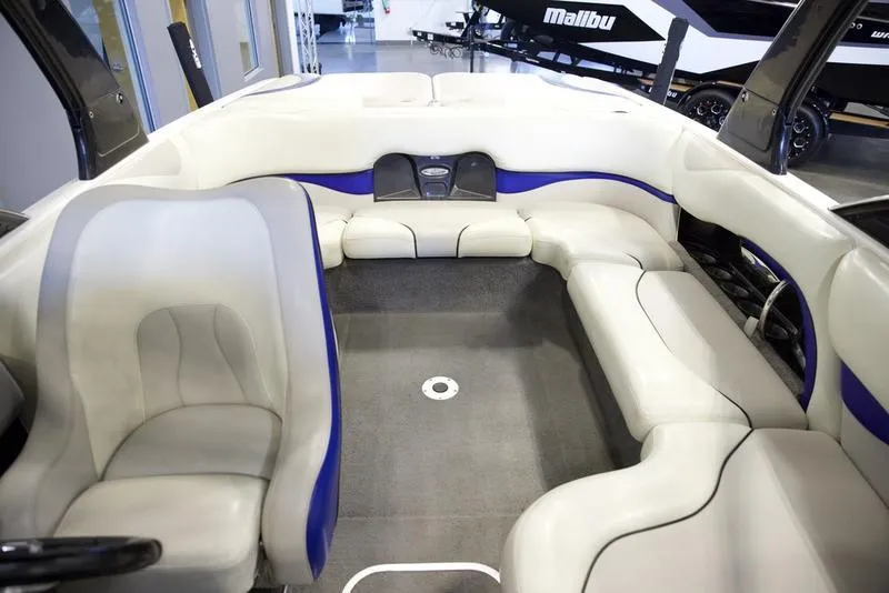 Slide: The Image of Interior of 2008 Malibu 21 VLX boat with white and blue seating. - 8