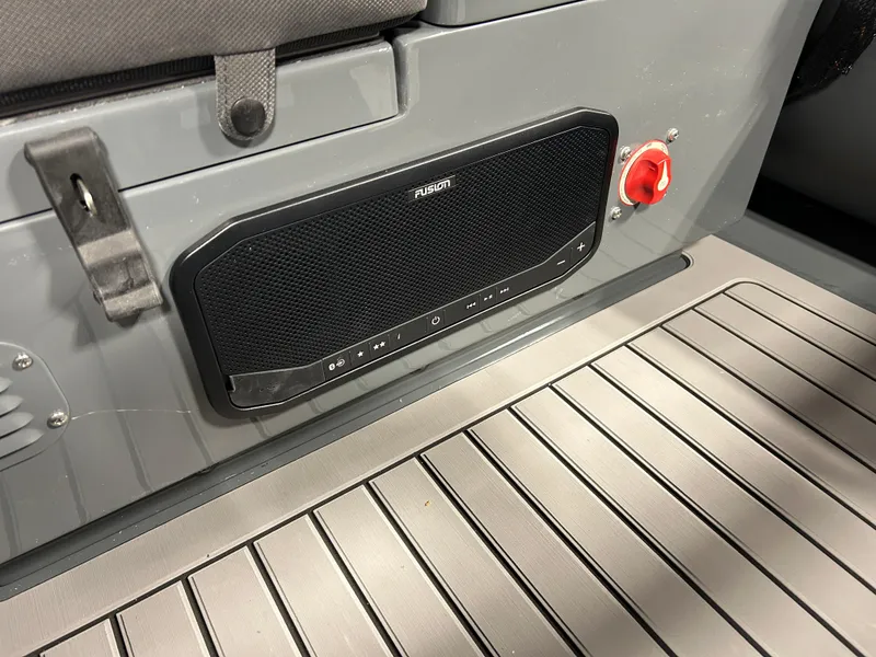 Slide: The Image of 2024 Highfield Sport 330 interior with Fusion audio system and red safety switch. - 10