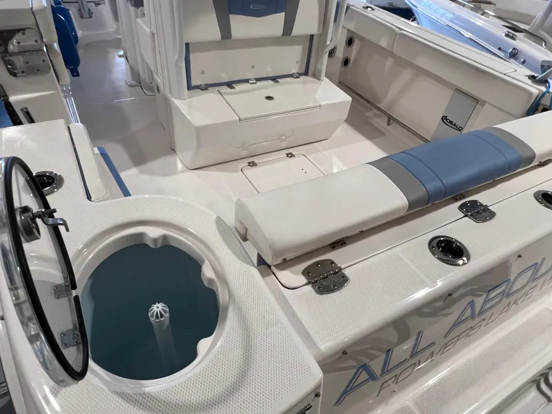 Slide: The Image of 2023 Robalo R 272 boat interior with seating and storage features. - 11