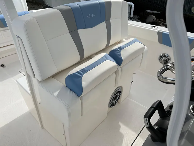 Slide: The Image of 2023 Robalo R 272 boat interior with white and blue seating. - 22