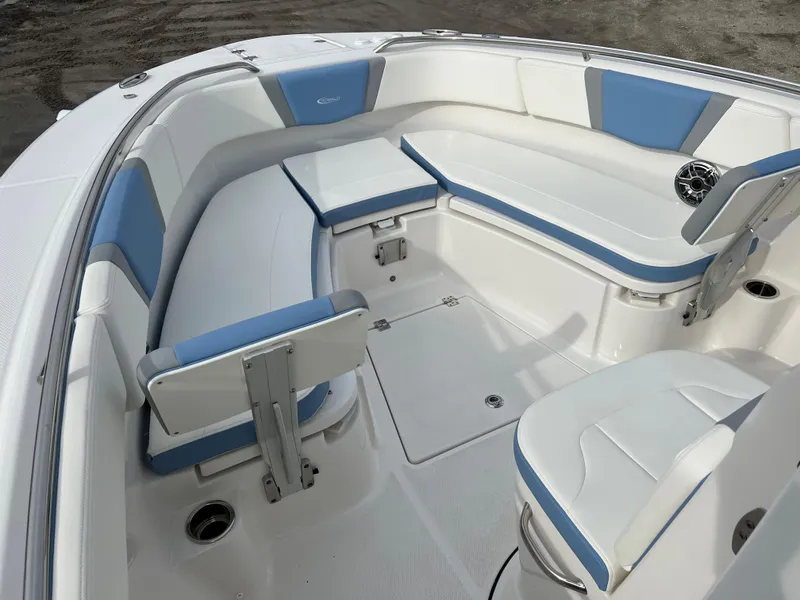 Slide: The Image of 2023 Robalo R 272 boat interior with white and blue seating. - 26
