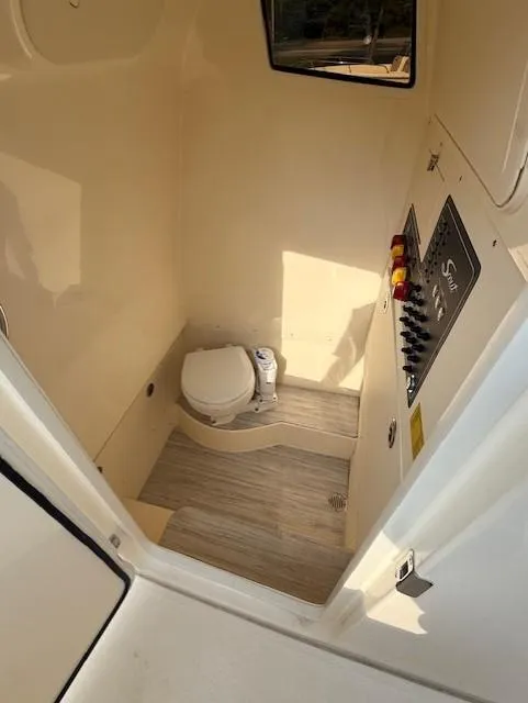 Slide: The Image of 2025 Scout 260 LXF boat interior with toilet and control panel. - 4