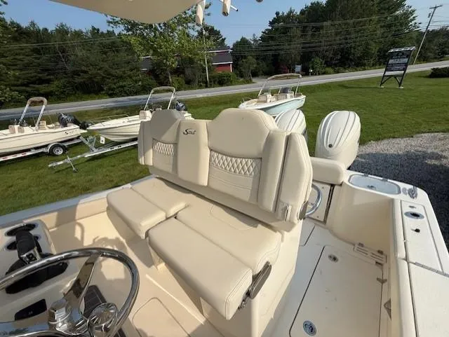 Slide: The Image of 2025 Scout 260 LXF boat interior with luxurious seating and dual engines. - 5
