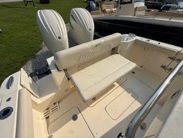 Slide: The Image of 2025 Scout 260 LXF boat with dual engines and foldable seating. - 8