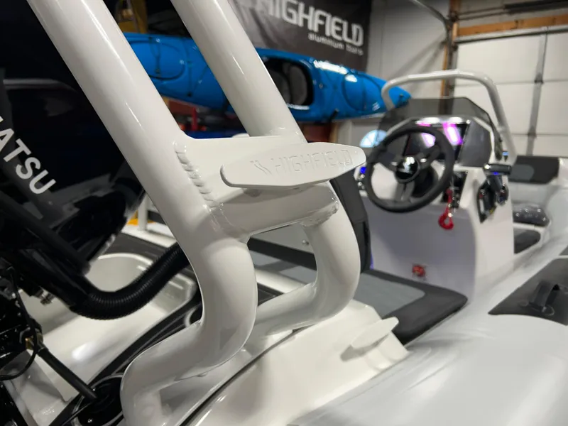 Slide: The Image of 2025 Highfield Sport 420 boat interior with steering wheel and controls. - 20