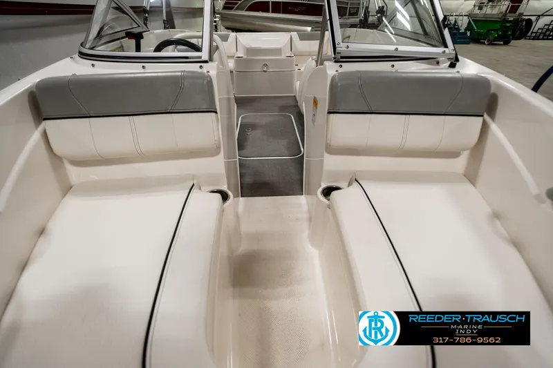 Slide: The Image of 2013 Bayliner 175 boat interior with white seating and gray accents. - 12