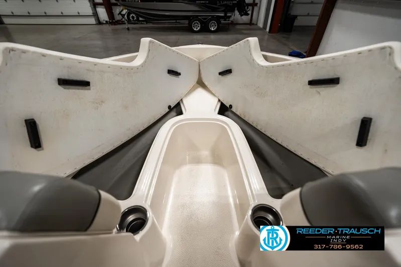 Slide: The Image of Interior view of a 2013 Bayliner 175 boat, showcasing seating and storage. - 18