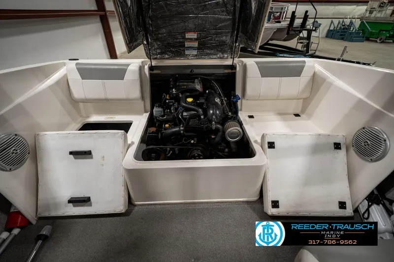 Slide: The Image of 2013 Bayliner 175 boat engine compartment in a showroom. - 23