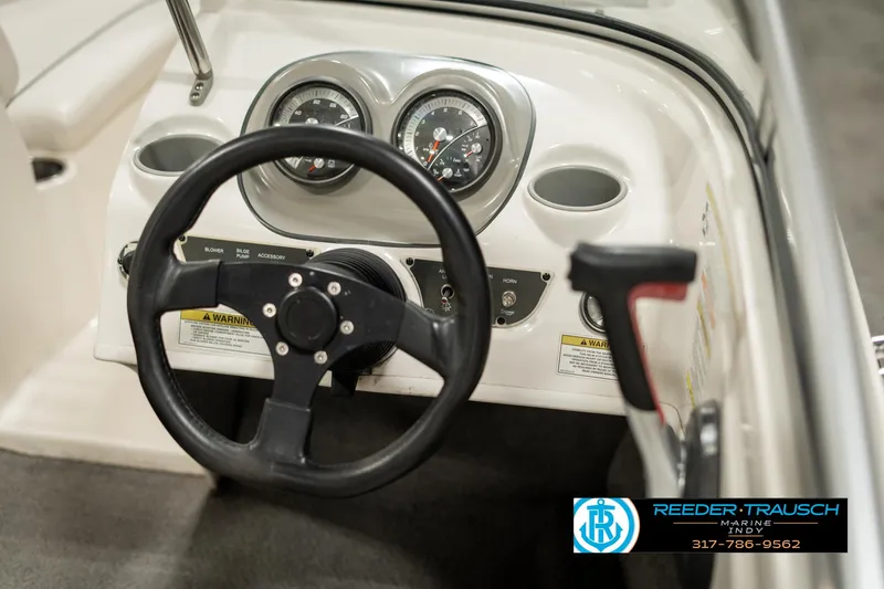 Slide: The Image of Steering wheel and dashboard of a 2013 Bayliner 175 boat. - 24