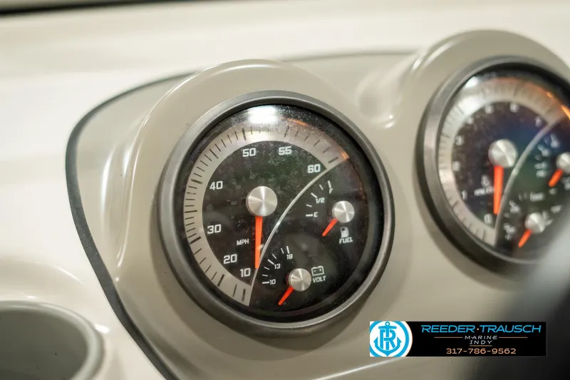 Slide: The Image of Close-up of 2013 Bayliner 175 boat dashboard gauges, showing speedometer and fuel indicators. - 27