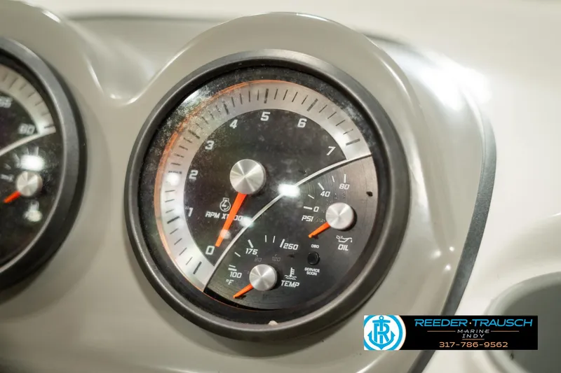 Slide: The Image of Close-up of 2013 Bayliner 175 boat dashboard gauge. - 28