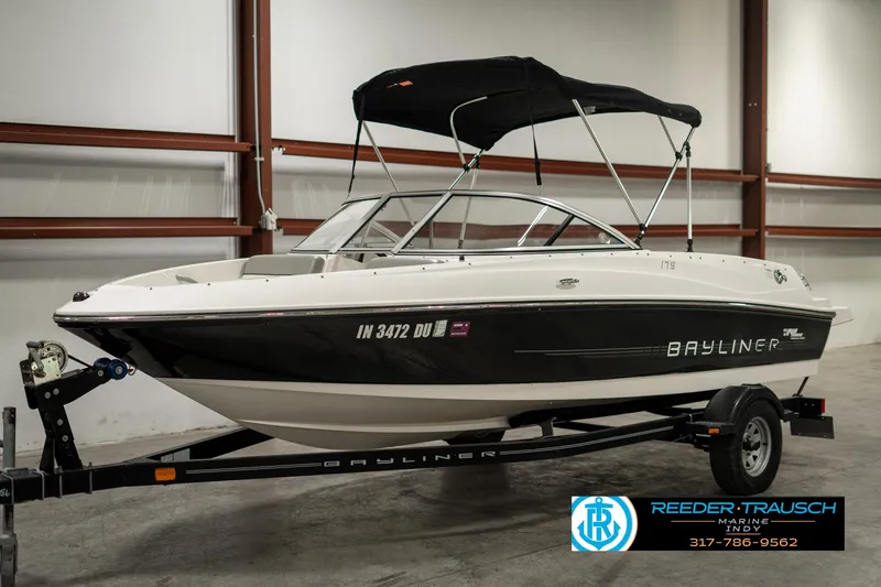 Slide: The Image of 2013 Bayliner 175 boat with trailer in indoor storage facility. - 3