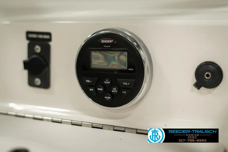 Slide: The Image of Close-up of a 2013 Bayliner 175 boat stereo system with control panel. - 31