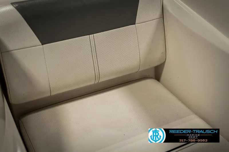 Slide: The Image of 2013 Bayliner 175 boat seat, beige and black upholstery, Reeder-Trausch Marine logo. - 33