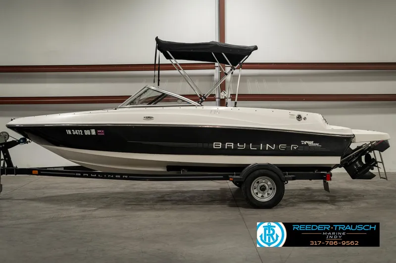Slide: The Image of 2013 Bayliner 175 boat with trailer in indoor storage facility. - 4