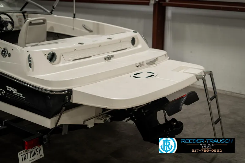 Slide: The Image of 2013 Bayliner 175 boat rear view with swim platform and ladder. - 40