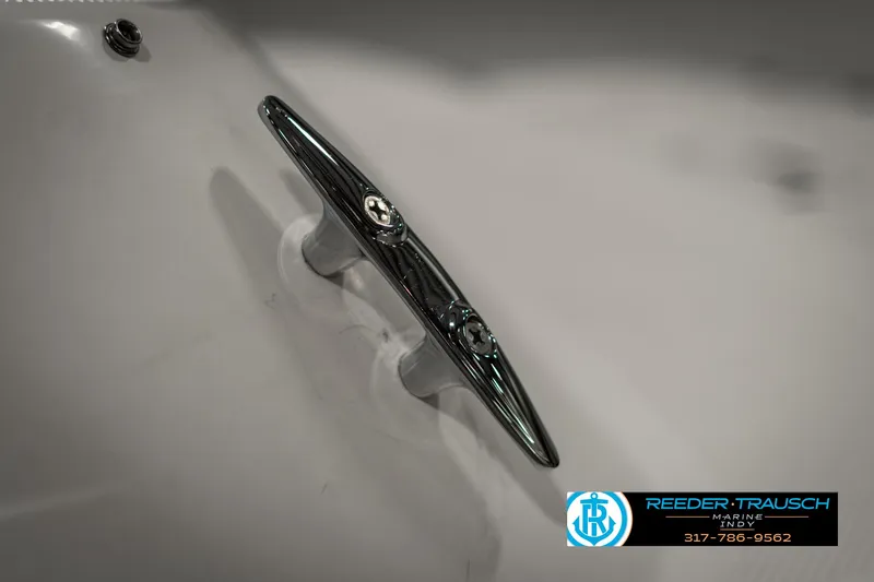 Slide: The Image of Close-up of a 2013 Bayliner 175 boat cleat with Reeder-Trausch logo. - 44