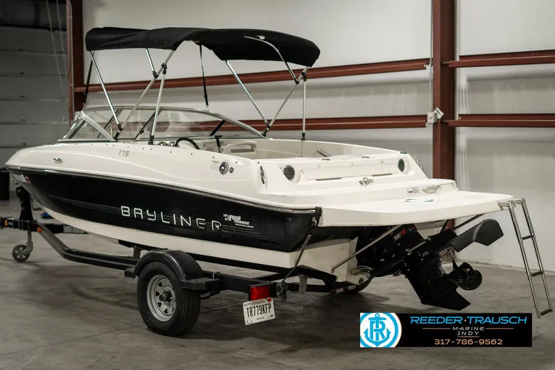 Slide: The Image of 2013 Bayliner 175 boat with trailer in indoor storage. - 5