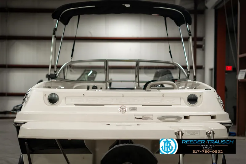 Slide: The Image of 2013 Bayliner 175 boat in showroom, rear view with canopy. - 6