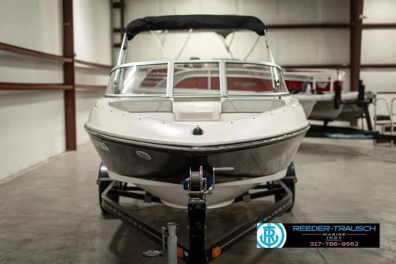 Slide: The Image of 2013 Bayliner 175 boat on trailer in indoor storage facility. - 7