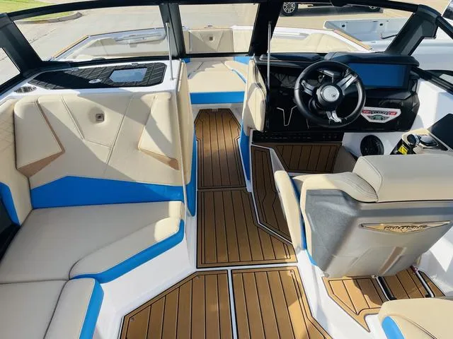 Slide: The Image of 2024 Nautique S23 boat interior with modern design and luxurious seating. - 11