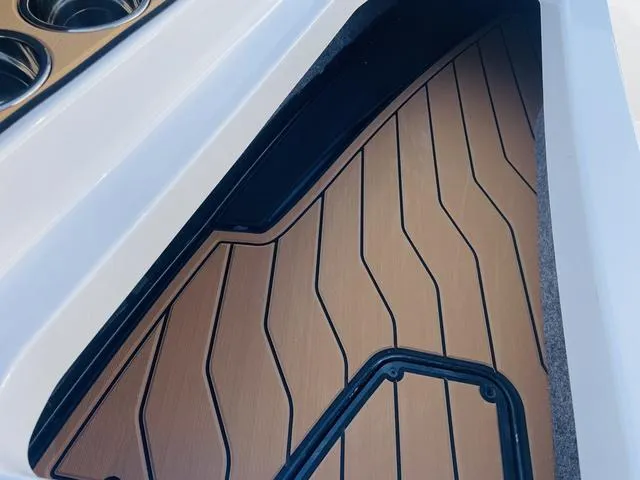 Slide: The Image of 2024 Nautique S23 boat interior with sleek, modern flooring design. - 15