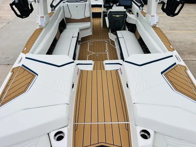 Slide: The Image of 2025 Nautique SUPER AIR G G25 boat interior with sleek seating and modern design. - 10