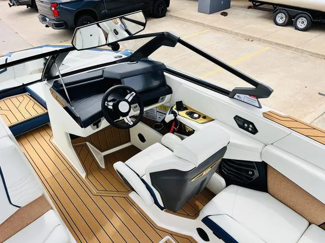 Slide: The Image of 2025 Nautique SUPER AIR G G25 boat interior with sleek design and modern controls. - 19