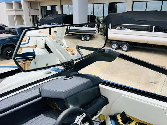 Slide: The Image of Interior view of 2025 Nautique SUPER AIR G G25 boat with rearview mirror. - 24
