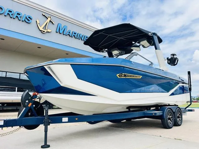 Slide: The Image of 2025 Nautique SUPER AIR G G25 boat on trailer at Morris Marine dealership. - 3