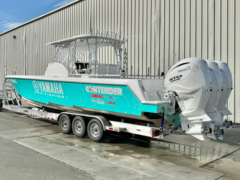 Slide: The Image of 2024 Contender 39 Fisharound boat with Yamaha engines on a trailer. - 10