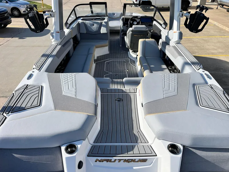 Slide: The Image of 2024 Nautique G25 boat interior with sleek gray seating and modern design. - 11