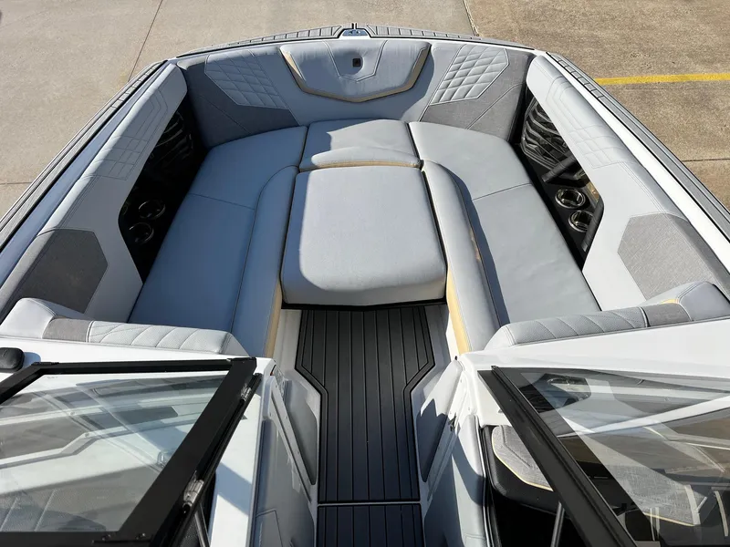 Slide: The Image of 2024 Nautique G25 boat interior with luxurious seating and modern design. - 13