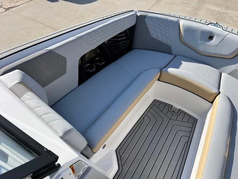 Slide: The Image of 2024 Nautique G25 boat interior with luxurious seating and modern design. - 16