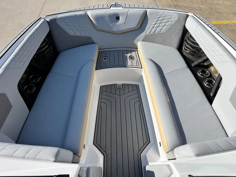 Slide: The Image of 2024 Nautique G25 boat interior with gray seating and sleek design. - 20