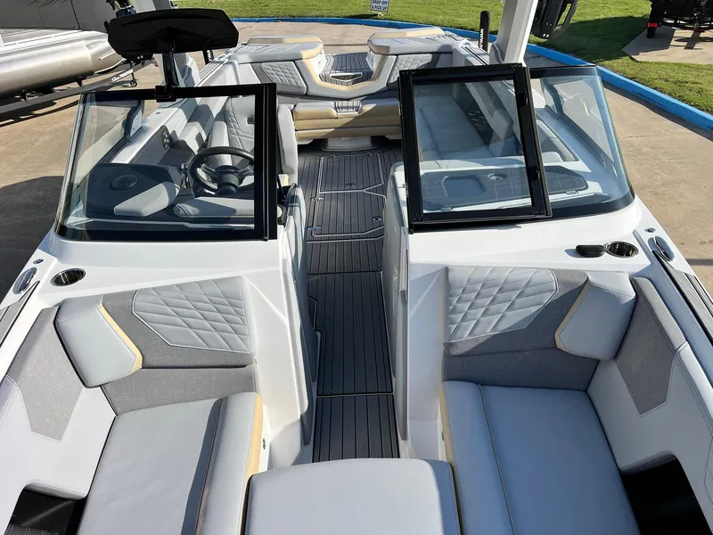 Slide: The Image of 2024 Nautique G25 boat interior with modern seating and sleek design. - 22
