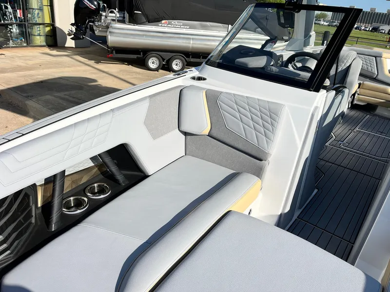 Slide: The Image of 2024 Nautique G25 boat interior with sleek seating and modern design. - 24