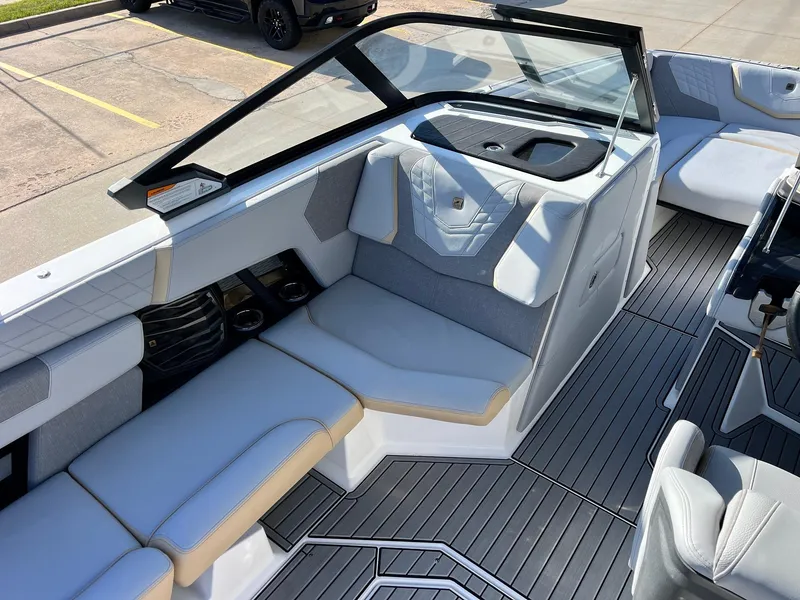 Slide: The Image of 2024 Nautique G25 boat interior with sleek seating and modern design. - 26