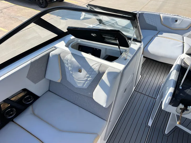 Slide: The Image of 2024 Nautique G25 boat interior with sleek seating and modern design. - 27